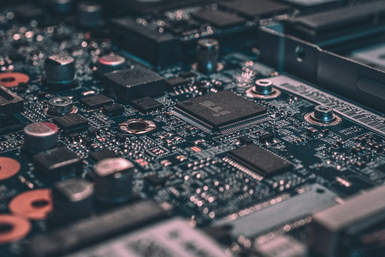 Close-up of a circuit board with chips and capacitors